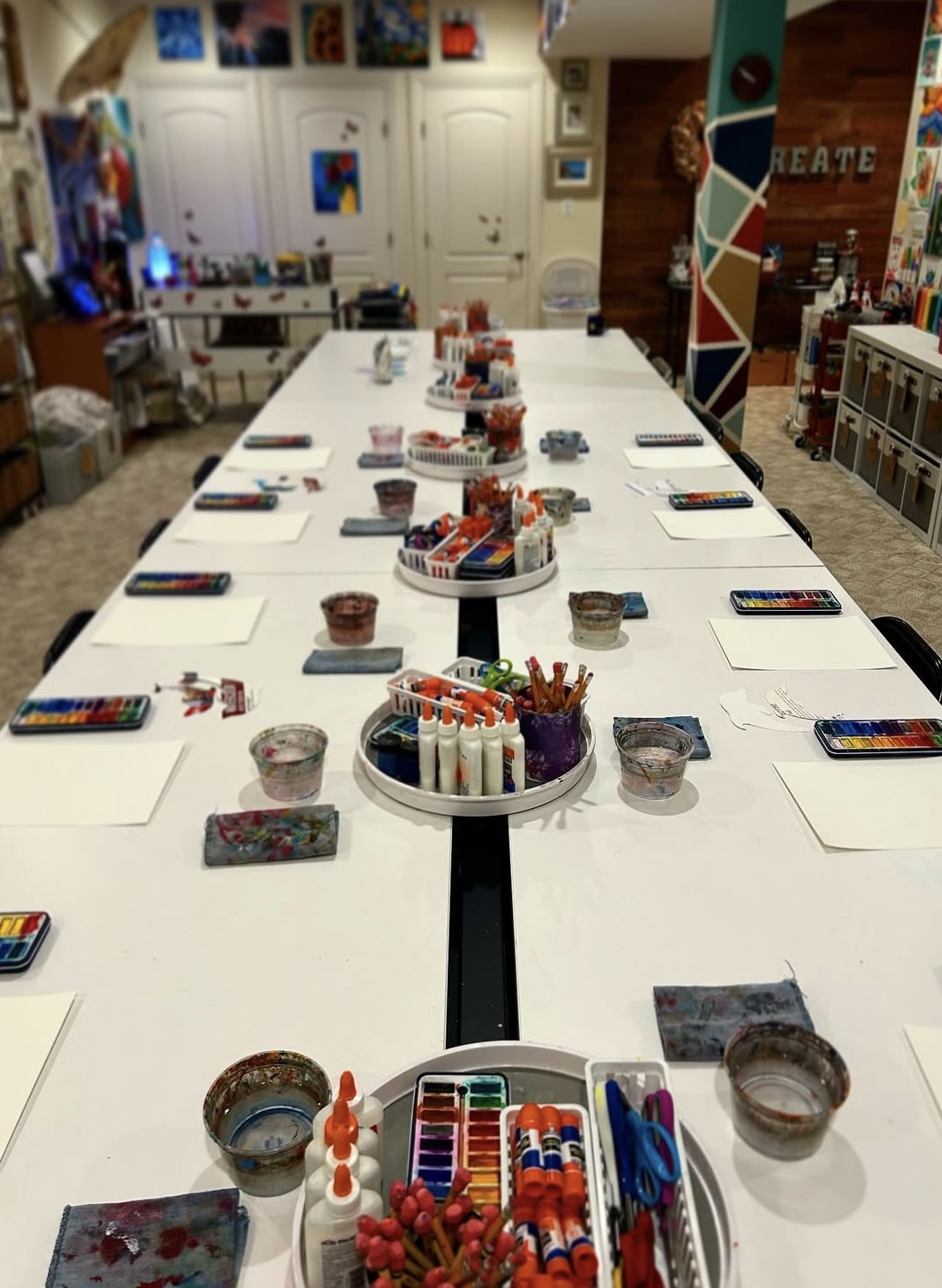 Class group holding up their finished drawings