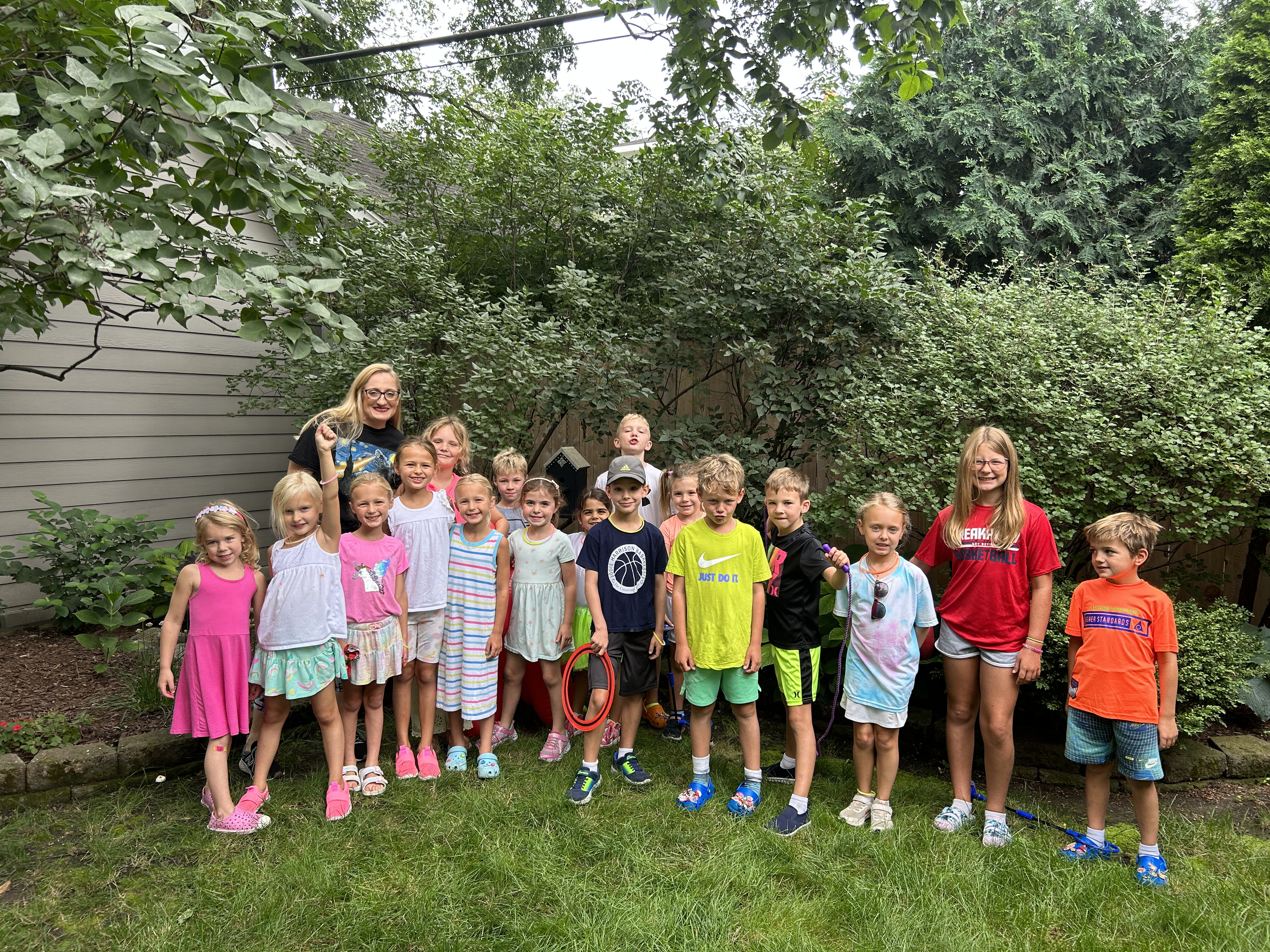 Summer camp group with Molly in the backyard